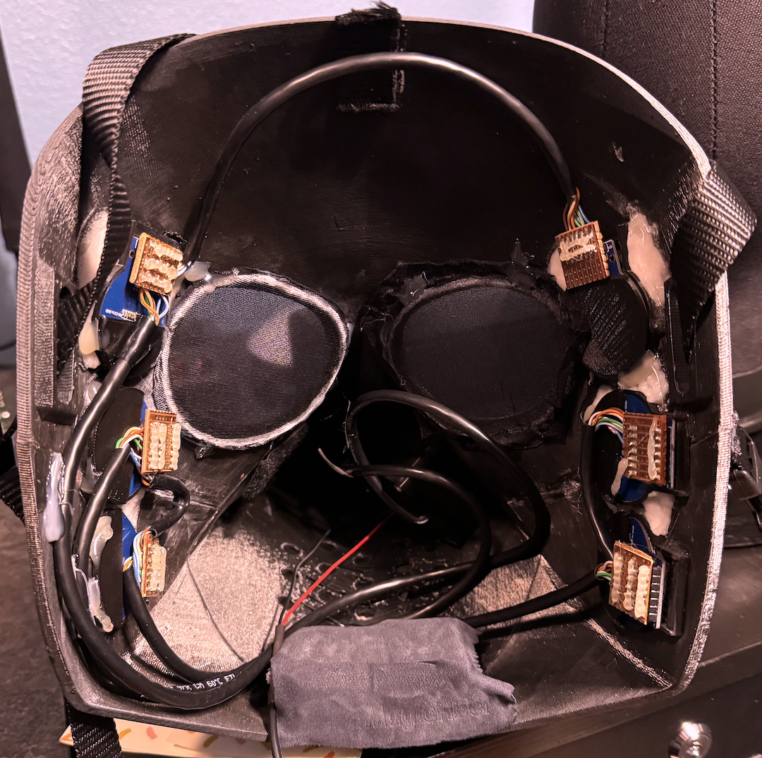The mask&rsquo;s interior. The cables leading into the beak were smooshed flat when it was being worn, and the USB power lead that comes out the bottom in this picture was connected to a USB power bank hidden in the beak.